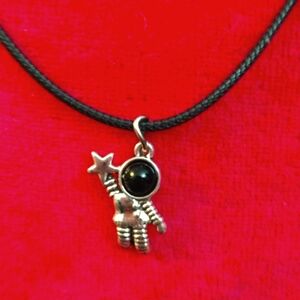 18",Black cotton necklace w/a  silver stainless steel astronaut